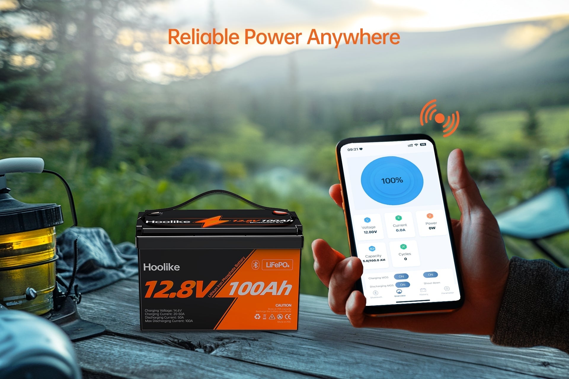 Hoolike 12.8V 100Ah LiFePO4 battery with Bluetooth monitoring in an outdoor camping setup.