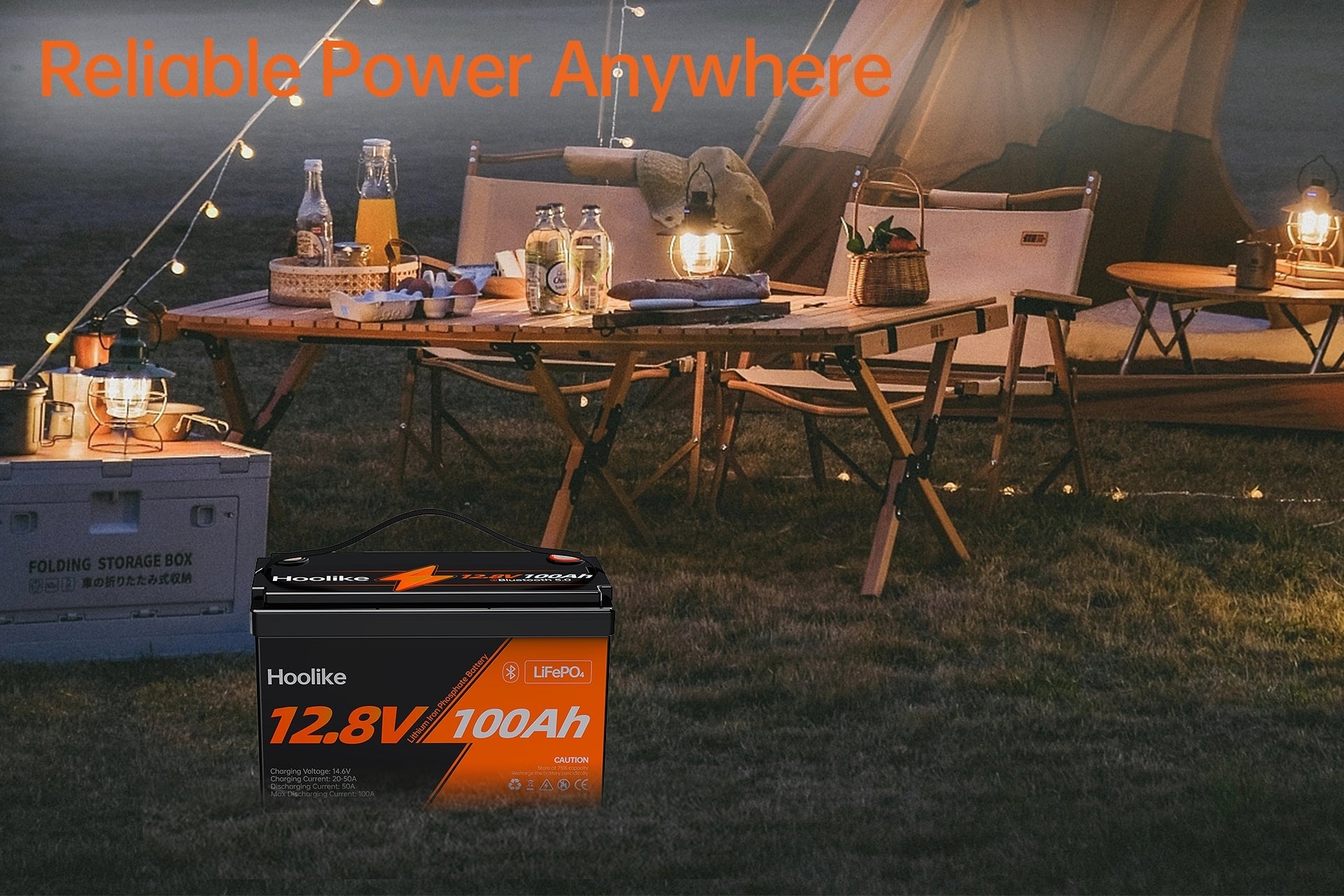 Hoolike 12.8V 100Ah LiFePO₄ battery providing reliable power for an outdoor camping setup with lights and appliances.